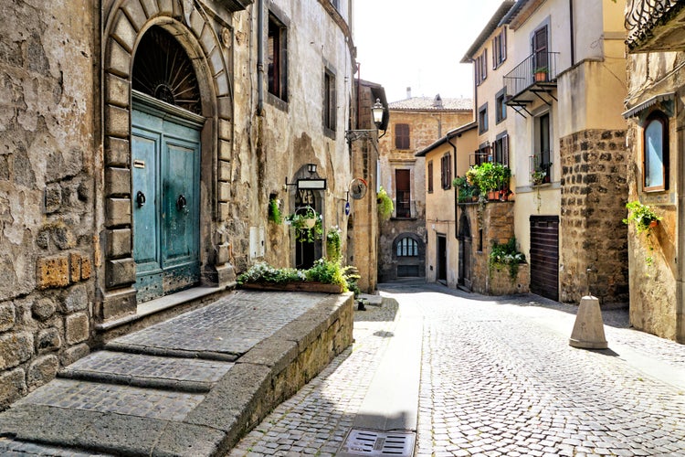 Photo of old stone buildings of the medieval hill town of Orvieto, Umbria, Italy.