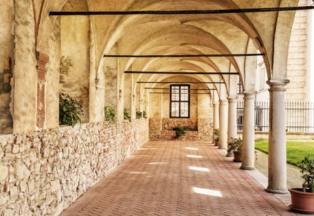 Photo of Medieval arcade corridor at Telc castle, Czech republic.