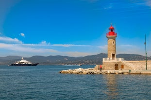 Photo of beautiful aerial view of Saint-Tropez, France with seascape and blue sky.