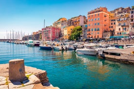 Photo of colorful houses on the shore of Bastia port, bright morning view of Corsica island, France.