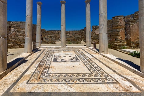 photo of view of The "House of Dionysus" in the archaeological site of the "sacred" island of Delos. Cyclades, Greece.