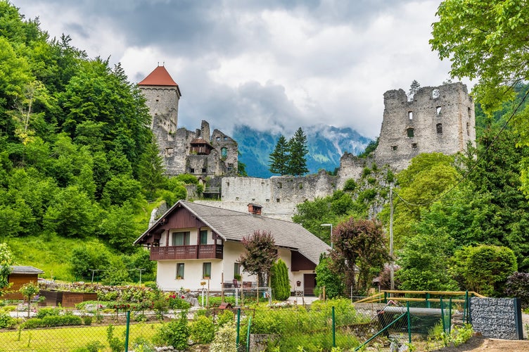 Photo of A view towards the Stone Castle ruins on the outskirts of the town of Begunje na Gorenjskem, Slovenia in summertime.