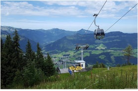 photo of beautiful alpine summer view with a church at Waidring, Tyrol, Austria.