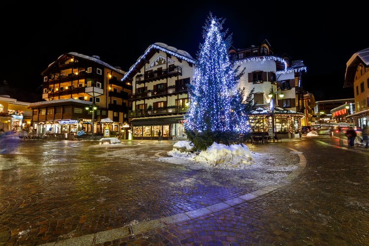 photo of Illuminated Central Square of Madonna di Campiglio in the Evening, Italian Alps, Italy.