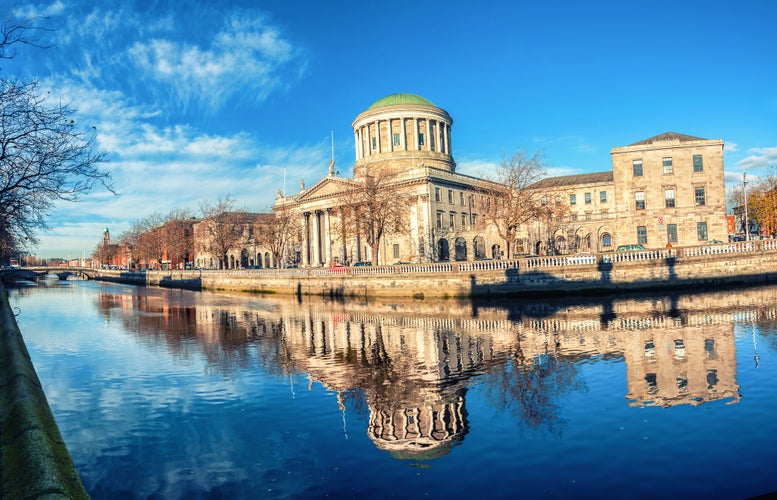 Four courts building in Dublin, Ireland with river Liffey.