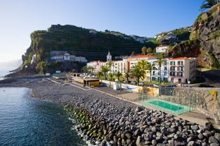 Photo of panoramic aerial view of idyllic coastal village of Porto da Cruz Madeira island, Portugal.