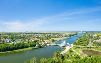 Photo of aerial view of the long sandy beach of Sword beach in Hermanville-sur-Mer towards Ouistreham ,France.