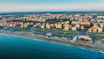 Aerial panoramic cityscape of Rome, Italy, Europe. Roma is the capital of Italy. Cityscape of Rome in summer. Rome roofs view with ancient architecture in Italy. 