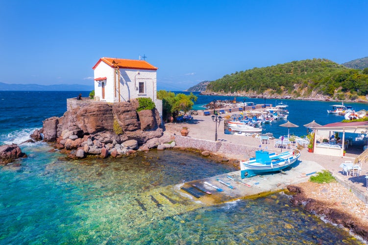 Photo of the little church of Panagia gorgona situated on a rock ,seaside village of Lesvos.