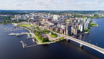 Early autumn morning panorama of the Port of Turku, Finland, with Turku Castle at background.