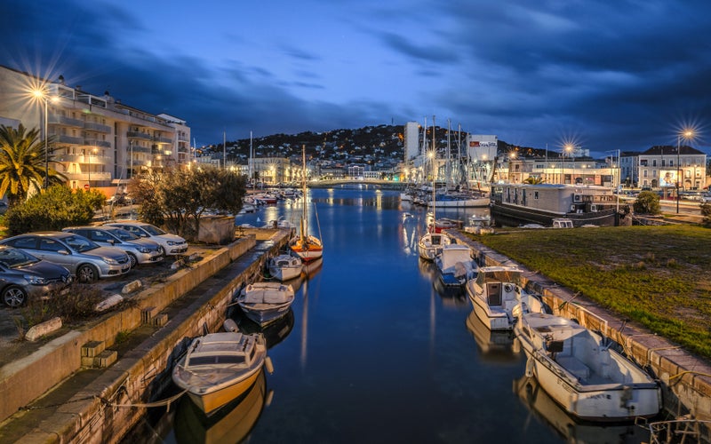 Beginning of the canal de la Peyrade, looking back to Sète (France), just before the beginning of the sunrise.