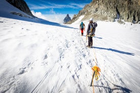 Photo of The winter view on the montains and ski lift station in French Alps near Chamonix Mont-Blanc.