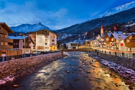 Photo of The mountain village at the Austrian ski resort Soelden on a cold and sunny winter day.