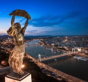 photo of Budapest, Hungary - Aerial panoramic view of Budapest from above, with Liberty Statue, Elisabeth bridge and Szechenyi Chain Bridge, Buda Castle, Matthias Church, Hungarian Parliament
