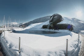 photo of an aerial view of Innsbruck, Austria during the winter morning, with snow and mountains at the background.