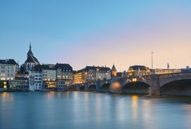 View of the Old Town of Basel with red stone Munster cathedral and the Rhine river, Switzerland.