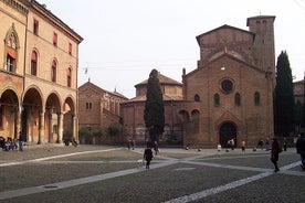 Photo of Italy Piazza Maggiore in Bologna old town tower of town hall with big clock and blue sky on background, antique buildings terracotta galleries.