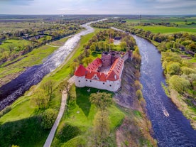 Photo of aerial view of Bauska Castle that is a complex consisting of the ruins of an earlier castle and a later palace on the outskirts of the Latvian city of Bauska, Latvia.