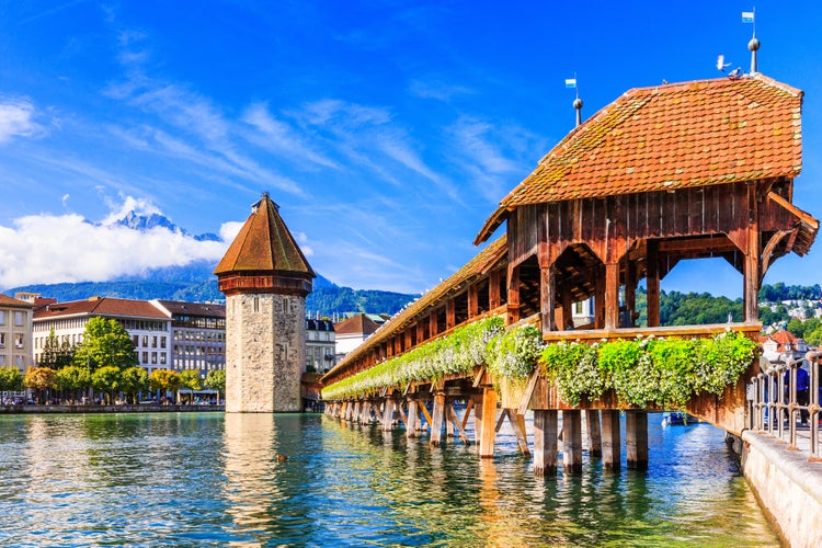 Lucerne, Switzerland. Historic city center with its famous Chapel Bridge and Mt. Pilatus on the background. (Vierwaldstattersee),