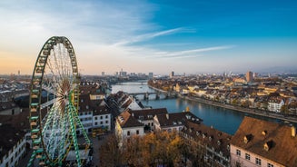 View of the Old Town of Basel with red stone Munster cathedral and the Rhine river, Switzerland.