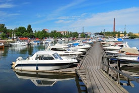 Early autumn morning panorama of the Port of Turku, Finland, with Turku Castle at background.