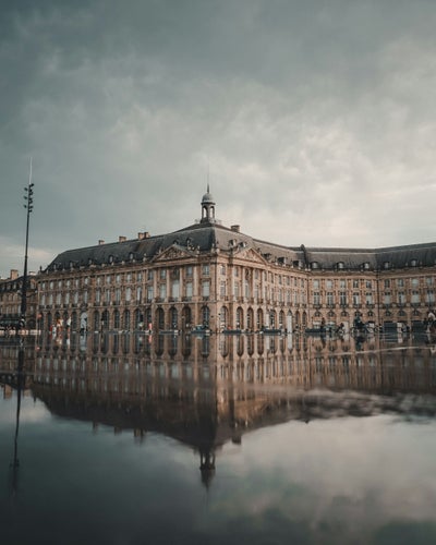 Bourse Square or Place de la Bourse and Miroir d’Eau or Water Mirror reflecting Bordeaux’s architecture in September..jpg