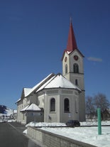 photo of the villages Schwyz and Rickenbach with the mountains Grosser Mythen and Kleiner Mythen in the background in Switzerland.