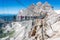 Photo of Suspension Bridge of Dachstein Skywalk viewpoint in Austria, with people, in Ramsau am Dachstein.