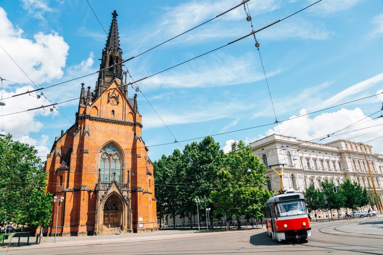 Photo of Old town street, The Church of Jan Amos Comenius Red Church and tram in Brno.