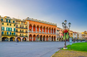 Photo of beautiful view of canal with statues on square Prato della Valle and Basilica Santa Giustina in Padova (Padua), Veneto, Italy.