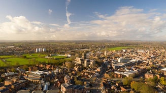 Photo of aerial view of Lichfield Cathedral with Stowe Pool and city centre, England.