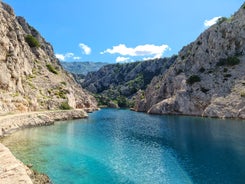 photo of  Pláž Senj it's a small beach hidden by vegetation near the Adriatic Sea, Senj, Croatia.