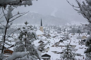 Photo of loisach river flowing through garmisch-partenkirchen, idyllic winter landscape bavaria.