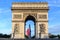 Photo of Arc de Triomphe  Early in the morning with the French flag, France.