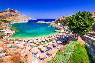 Photo of panoramic aerial view of Lindos bay, village and Acropolis, Rhodes, Greece.