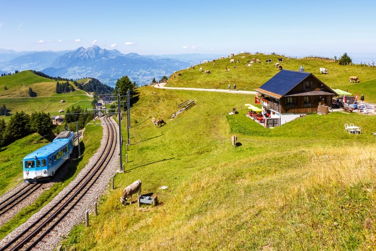 photo of Arth–Rigi railway line rack railway train on Rigi mountain in Swiss Alps in Switzerland.