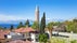 photo of YivliMinare Mosque or Alaaddin Mosque located in Kaleici district old town center of Antalya, Turkey. Sunny weather, clear blue sky and sea.