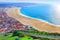 Photo of wonderful romantic afternoon aerial landscape coastline of Nazare beach riviera (Praia da Nazare) with cityscape of Nazare town ,Portugal.