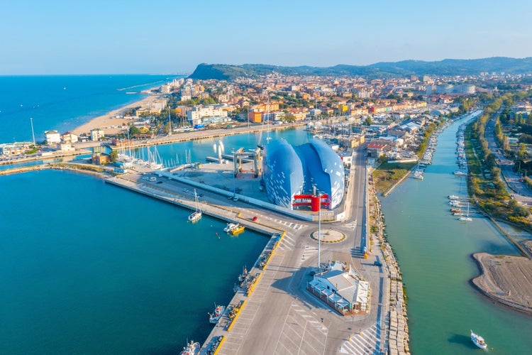 panoramic aerial view outside the port of Pesaro where you can see the Levante and Ponente beaches, the port with the nautical center and the breakwater cliffs,the park mountain of San Bartolo