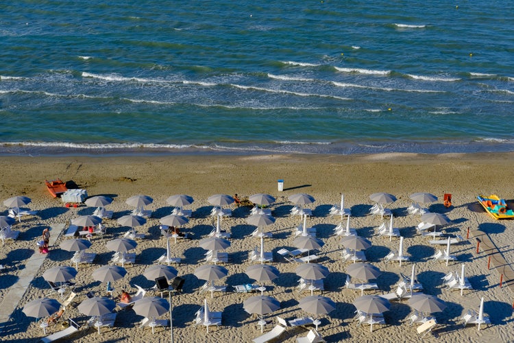 Senigallia Beach. View under umbrellas and main beach.