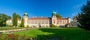 Łańcut castle in Poland. Built in the first half of 17th century. Front view panorama with a lawn, and roses