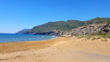 Photo of Beach seashore with wooden path to sea water in San Pedro del Pinatar