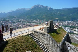 Photo of morning cityscape view with mountains, river and bridge in Grenoble city on the south-east of France.