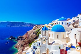 Photo of beautiful White architecture of Oia village on Santorini island, Greece.