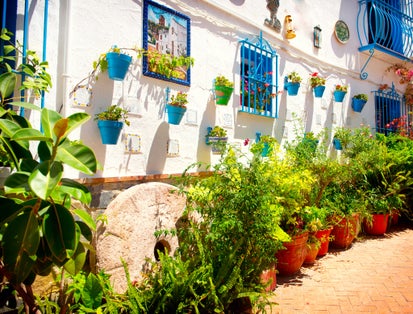Torremolinos. Costa del Sol, Andalucia. Typical White Village with flower pots in facades at Spain