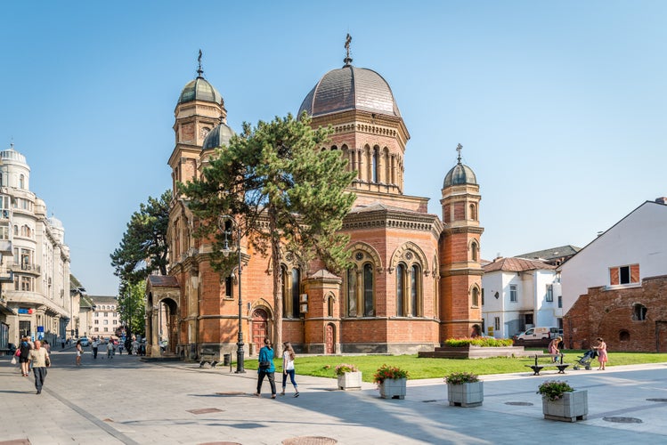 Photo of People are walking in streets near Saint Elias Church. Built 1890. Craiova. Romania.