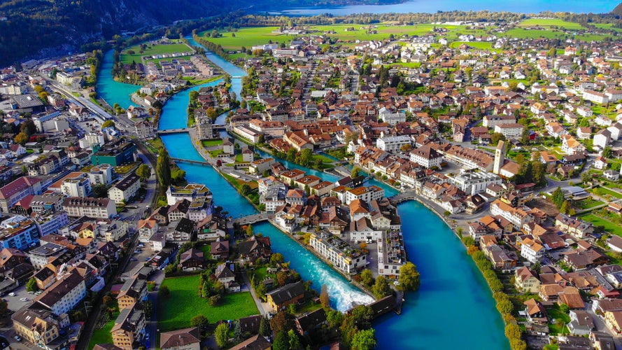 Photo of Aerial view over the city of Interlaken in Switzerland - amazing drone footage .