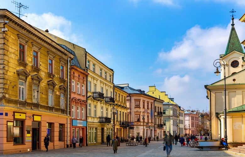 Photo of traditional colored tenements houses on central streets of Polish city of Lublin in sunny spring day, Poland.