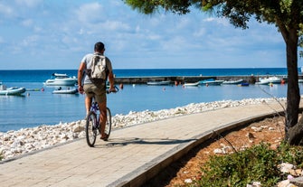 Photo of aerial view of beautiful town of Medulin waterfront view, Istria region of Croatia.