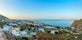 Photo of scenic aerial view of Kamari village and beach at sunrise, Greece.